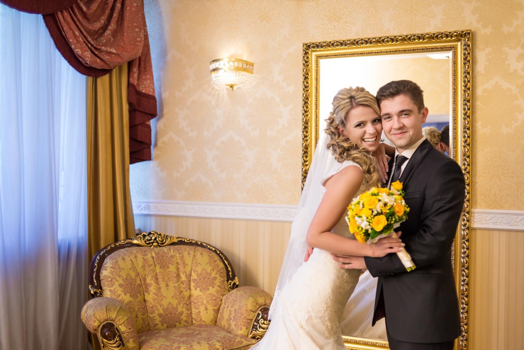 Original licensed wedding portrait in a gold interior